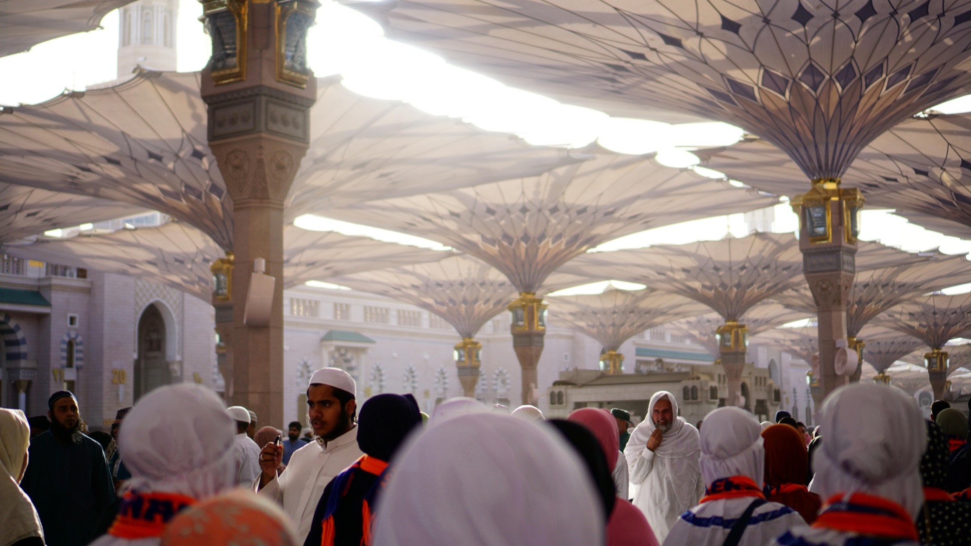 Pilgrims beneath the umbrellas of Masjid an-Nabawi